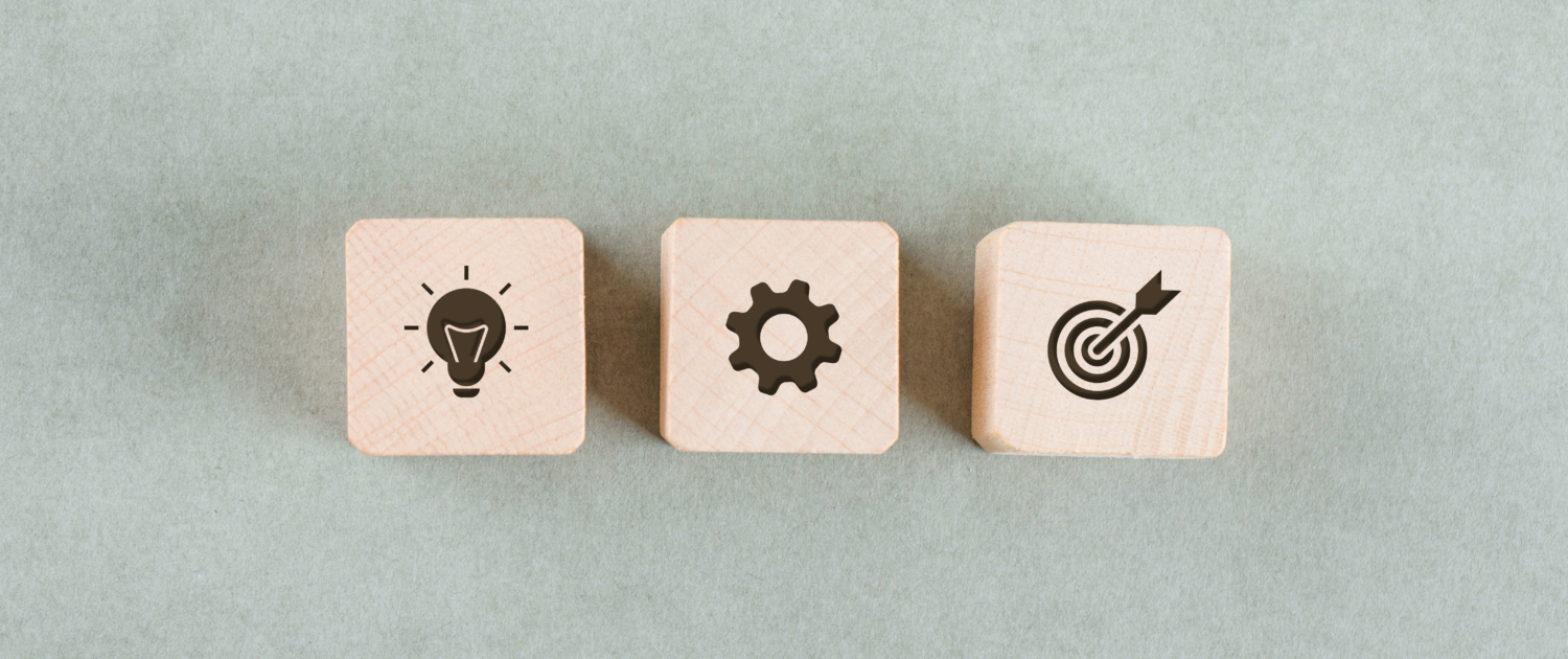 Target concept with wooden blocks on sage color background flat lay. free space for your text. horizontal image